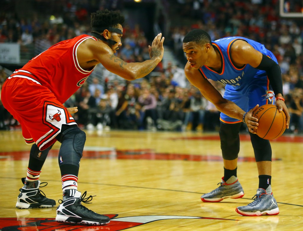 Chicago Bulls guard Derrick Rose (1) defends Oklahoma City Thunder guard Russell Westbrook (0) during the second half of an NBA basketball game in Chicago, on Thursday, Nov. 5, 2015. The Bulls won the game 104-98. AP
