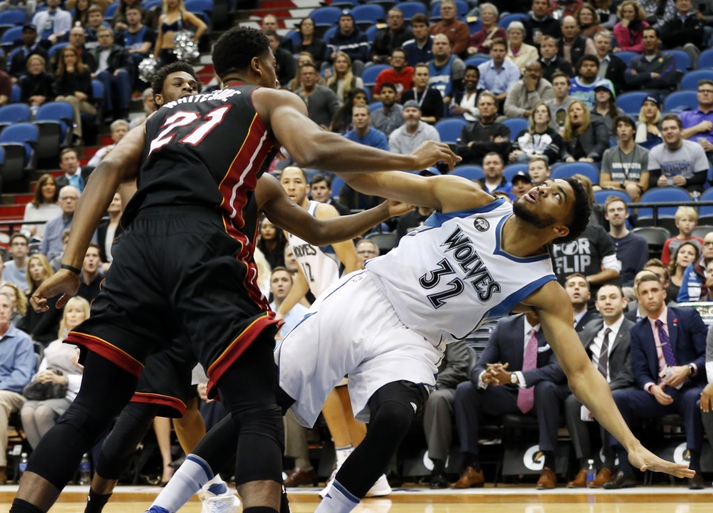 Minnesota Timberwolves’ Karl-Anthony Towns, right, is fouled by Miami Heat’s Hassan Whiteside after a shot-attempt in the first quarter of an NBA basketball game, Thursday, Nov. 5, 2015, in Minneapolis. AP