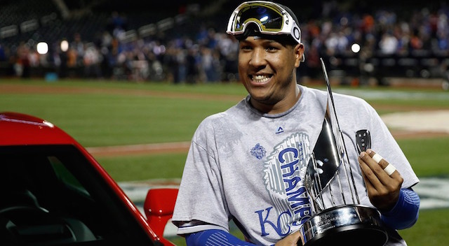 Kansas City Royals catcher Salvador Perez poses with his trophy after being named the MVP after Game 5 of the Major League Baseball World Series against the New York Mets Monday, Nov. 2, 2015, in New York. The Royals won 7-2 to win the series. AP