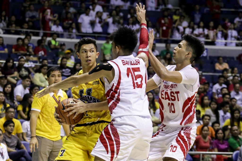 Kevin Ferrer vs two UE defenders. Photo by Tristan Tamayo/INQUIRER.net
