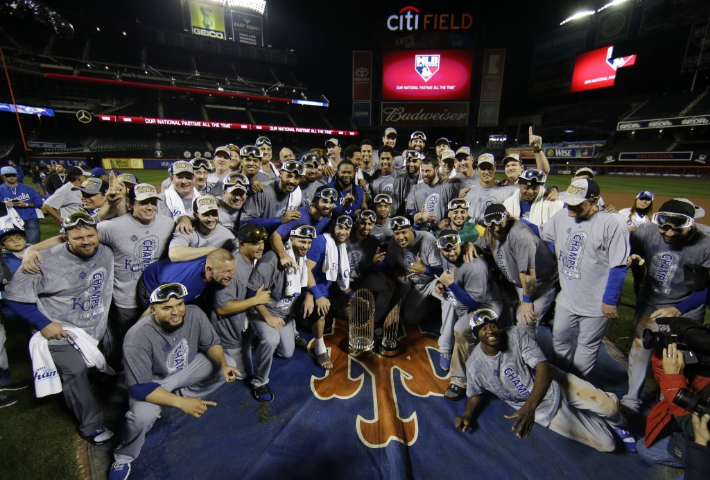Kansas City Royals pose with World Series trophy after Game 5 of the Major League Baseball World Series against the New York Mets Monday, Nov. 2, 2015, in New York. The Royals won 7-2 to win the series. (AP Photo/Matt Slocum)