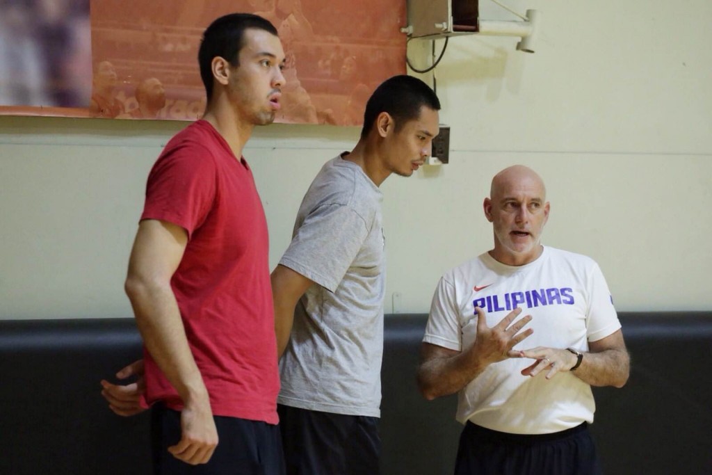 Barangay Ginebra's twin towers Greg Slaughter (left) and Japeth Aguilar chat with Gilas Pilipinas head coach Tab Baldwin. Slaughter, Aguilar and teammate LA Tenorio skipped practice to rest. Tristan Tamayo/INQUIRER.net 