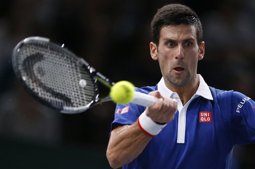 Novak Djokovic of Serbia returns the ball to Tomas Berdych of Czech Republic during their quarterfinal match of the BNP Masters tennis tournament, at Bercy Arena, in Paris, France, Friday, Nov. 6, 2015. AP PHOTO