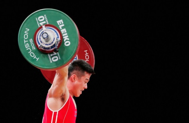 FILE - Un Guk Kim of North Korea competes in the men's 62kg weight class during the 2015 International Weightlifting Federation World Championships at the George R. Brown Convention Center on November 22, 2015 in Houston, Texas.   Scott Halleran/Getty Images/AFP