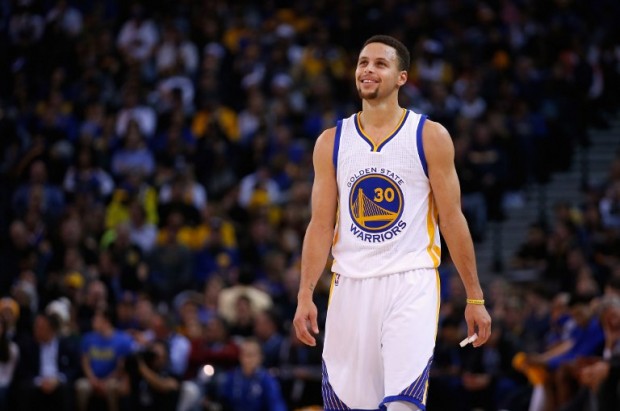 FILE - Stephen Curry #30 of the Golden State Warriors smiles during their game against the Phoenix Suns at ORACLE Arena on December 16, 2015 in Oakland, California.   Ezra Shaw/Getty Images/AFP