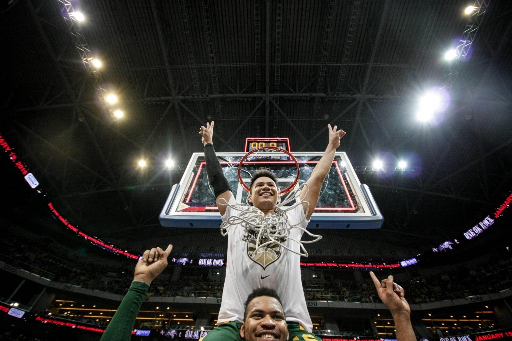 Roger Pogoy, one-third of the Far Eastern University Tamaraws' tough trip, rides on the shoulders of teammate Prince Orizu, as both key players celebrate their team's first UAAP championship in 10 years. Tristan Tamayo/INQUIRER.net