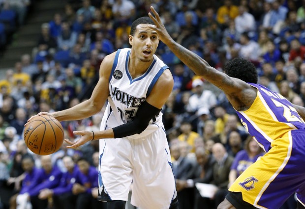 Minnesota Timberwolves guard Kevin Martin, left, looks to pass under pressure from Los Angeles Lakers guard Louis Williams, right, during the first half of an NBA basketball game in Minneapolis, Wednesday, Dec. 9, 2015. There Timberwolves won 123-122 in overtime. (AP Photo/Ann Heisenfelt)