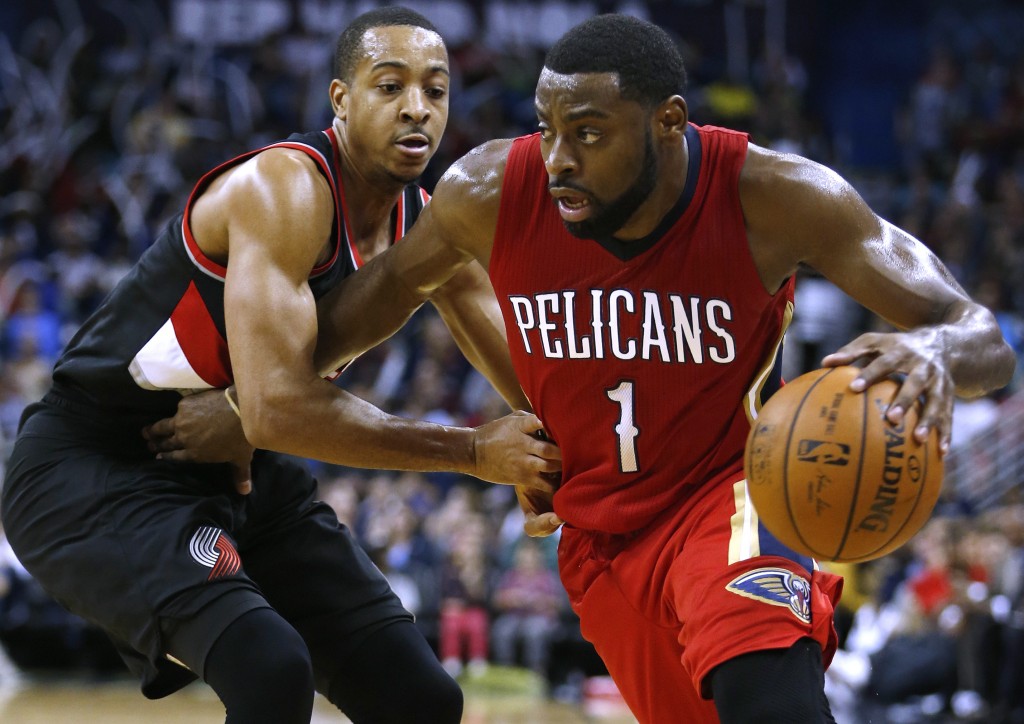 New Orleans Pelicans guard Tyreke Evans (1) drives against Portland Trail Blazers guard C.J. McCollum during the second half of an NBA basketball game Wednesday, Dec. 23, 2015, in New Orleans. The Pelicans won 115-89. (AP Photo/Jonathan Bachman)