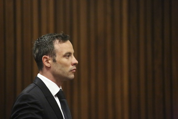 Oscar Pistorius sits in the dock in a courtroom at the High Court in Pretoria, South Africa, Tuesday Dec. 8, 2015. Pistorius wants to take his case to the Constitutional Court, challenging an appeals court that convicted him of murdering girlfriend Reeva Steenkamp, the Olympian's lawyer said. (AP Photo/Siphiwe Sibeko, Pool)