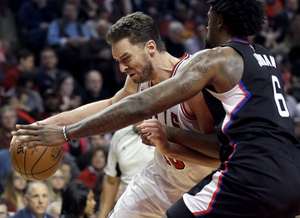 Chicago Bulls’ Pau Gasol, left, drives against Los Angeles Clippers’ DeAndre Jordan. AP