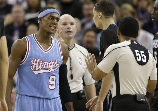 Sacramento Kings guard Rajon Rondo, left, questions official Bill Kennedy (55) about a foul call during the second half of an NBA basketball game against the Minnesota Timberwolves in Sacramento, Calif., Friday, Nov. 27, 2015. The Timberwolves won 101-91. AP PHOTO