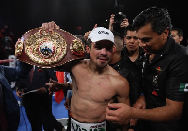 FILE --Juan Manuel Marquez celebrates his victory over Mike Alvarado at The Forum on May 17, 2014 in Inglewood, California.   Jeff Gross/Getty Images/AFP