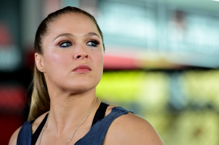 FILE -- Ronda Rousey speaks to media at a press conference leading up to her fight against Holly Holm in UFC 183 at the Glendale Fighting Club on October 27, 2015 in Glendale, California.   Harry How/Getty Images/AFP