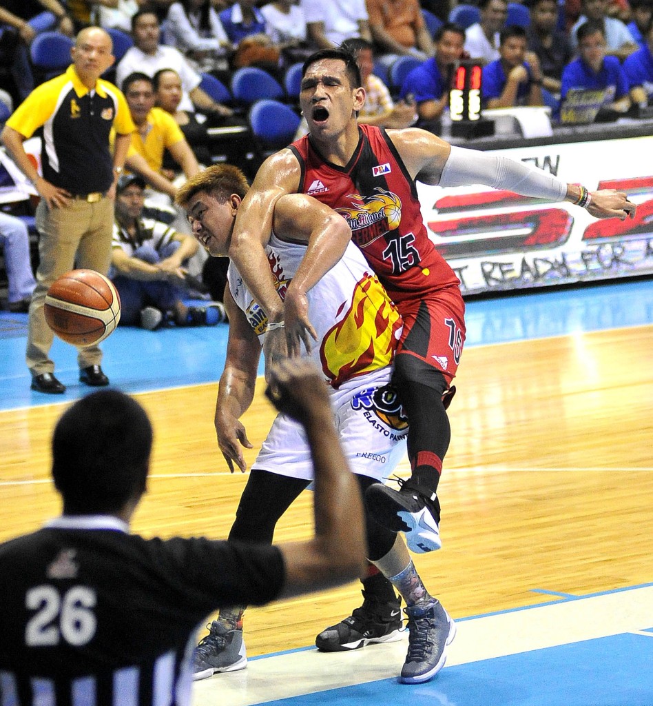 JUNE Mar Fajardo (right) is whistled for a foul after going over the back of Rain or Shine’s Beau Belga during last night’s Game 5 semifinal duel between the two squads. AUGUST DELA CRUZ