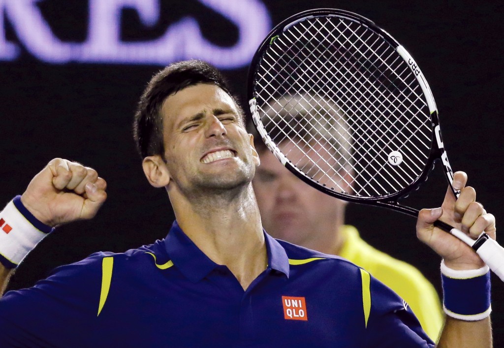 Novak Djokovic of Serbia celebrates after defeating Roger Federer of Switzerland in their semifinal match at the Australian Open tennis championships in Melbourne, Australia, Thursday, Jan. 28, 2016.(AP Photo/Aaron Favila)