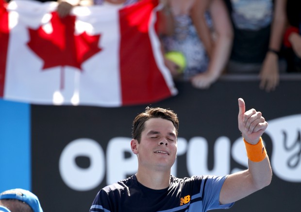 Milos Raonic of Canada celebrates after defeating Tommy Robredo of Spain in their second round match at the Australian Open tennis championships in Melbourne, Australia, Thursday, Jan. 21, 2016.(AP Photo/Vincent Thian)