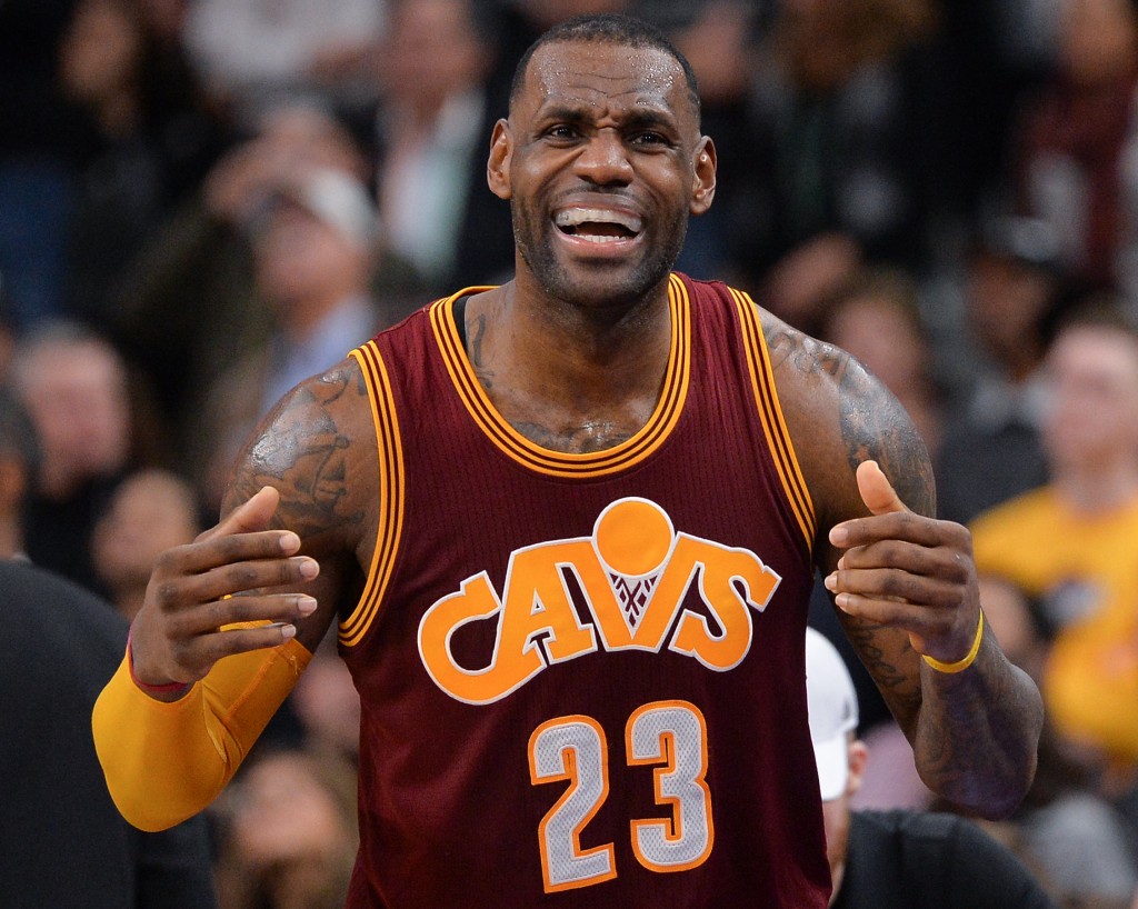 Cleveland Cavaliers forward LeBron James gestures to the Cleveland bench during the second half of an NBA basketball game against the San Antonio Spurs, Thursday, Jan. 14, 2016, in San Antonio. San Antonio won 99-95. (AP Photo/Darren Abate)