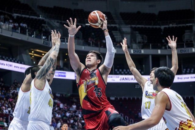 San Miguel Beer center June Mar Fajardo takes a shot against four Rain or Shine defenders during Game 1 of the 2016 PBA Philippine Cup semifinals Tuesday night at Mall of Asia Arena. Tristan Tamayo/INQUIRER.net