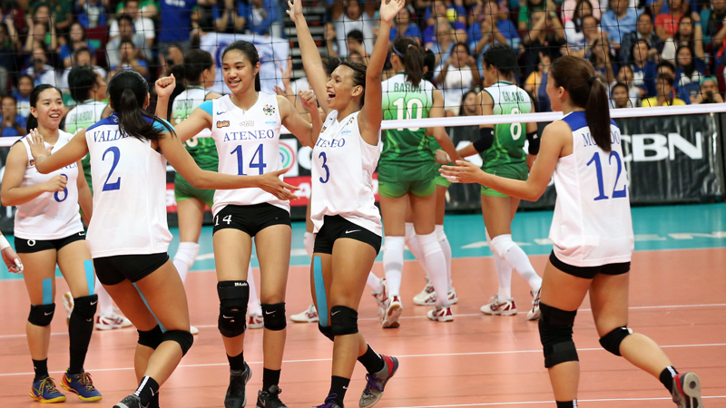FILE - The Lady Eagles celebrate a key point against the Lady Spikers in the fifth set. MARIANNE BERMUDEZ