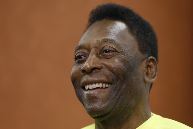 FILE - In this March 20, 2015 file photo, Brazilian soccer legend Pele smiles during a media opportunity at a restaurant in London. A spokesman for Pele says the Brazilian football legend is recovering well from a corrective hip surgery he recently underwent in New York City, it was reported on Friday Jan. 15, 2016. (AP Photo/Kirsty Wigglesworth, File)