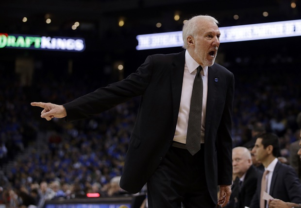 San Antonio Spurs head coach Gregg Popovich yells at players on the bench during the second half of an NBA basketball game against the Golden State Warriors Monday, Jan. 25, 2016, in Oakland, Calif. The Warriors won 120-90. (AP Photo/Marcio Jose Sanchez)