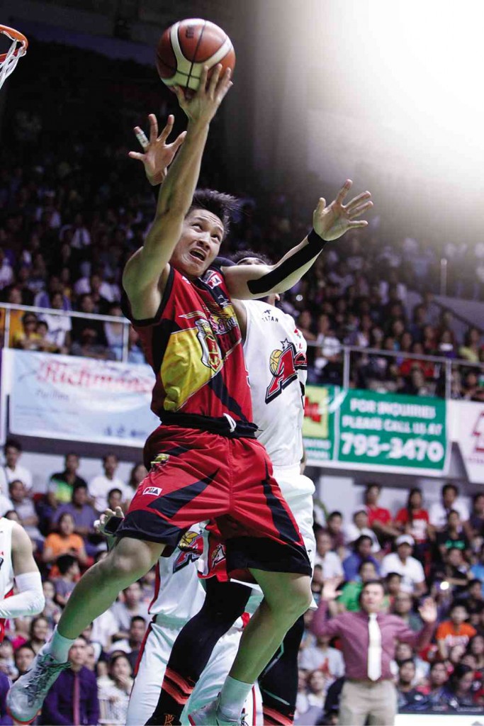 ALEX Cabagnot of San Miguel Beer goes for a tough undergoal stab in last night’s Game 3 in Lucena City. PBA IMAGES