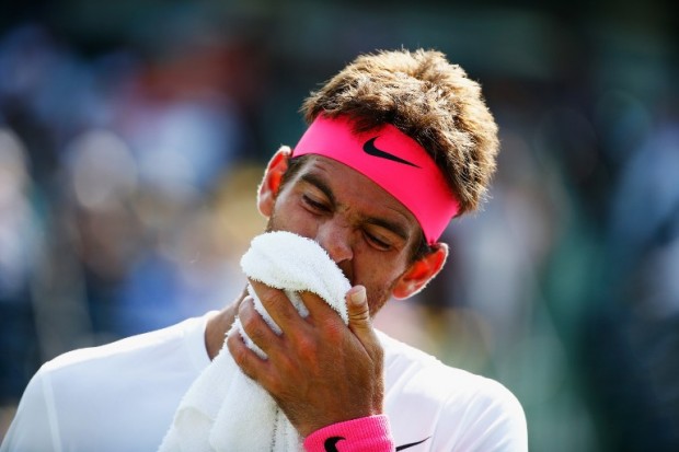 FILE --- Juan Martin Del Potro of Argentina reacts to a lost point to Vasek Pospisil of Canada during day 4 of the Miami Open at Crandon Park Tennis Center on March 26, 2015 in Key Biscayne, Florida.   Al Bello/Getty Images/AFP