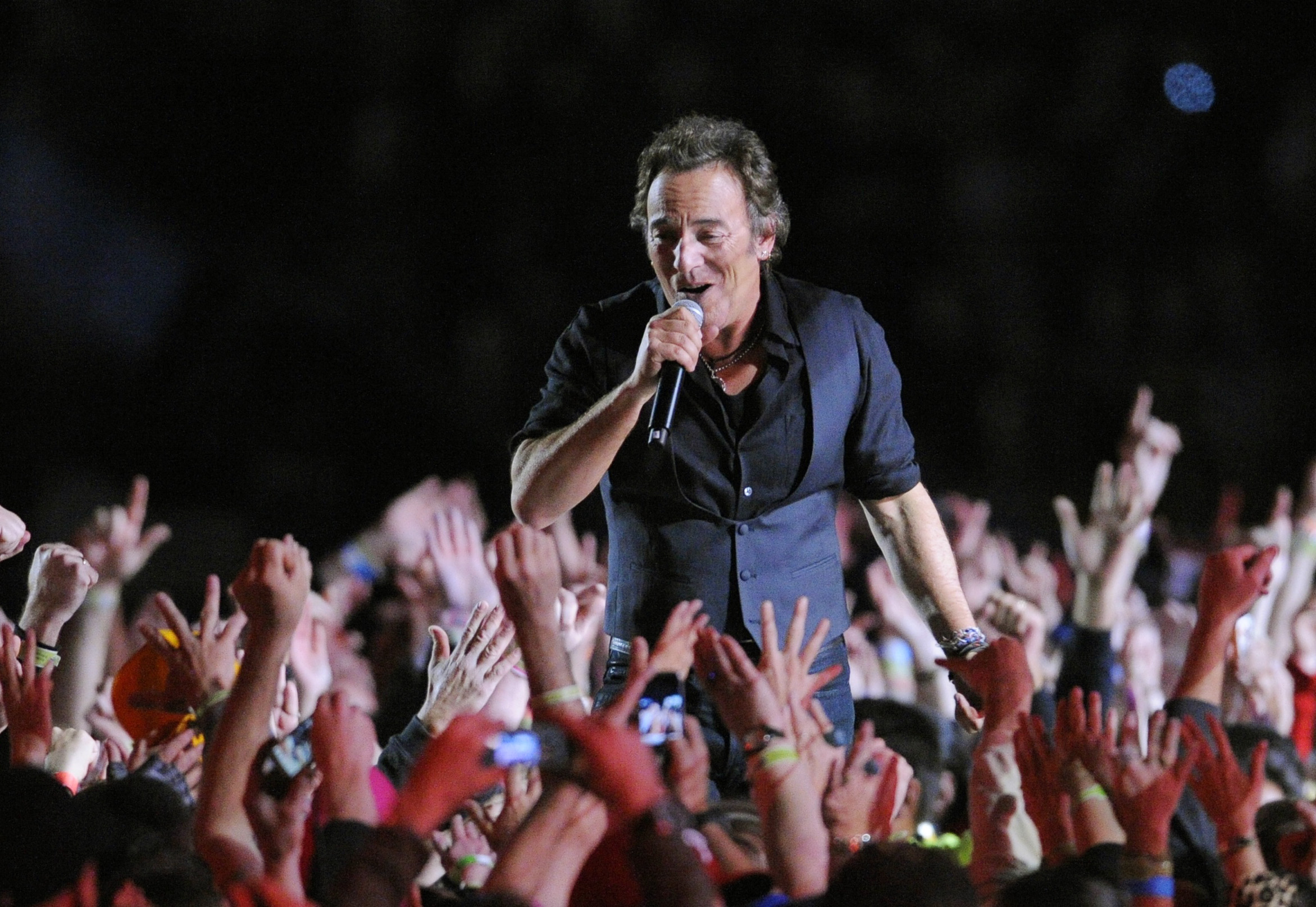 In this Feb. 1, 2009 file photo, Bruce Springsteen performs during halftime of the NFL Super Bowl XLIII football game between the Arizona Cardinals and the Pittsburgh Steelers in Tampa, Florida. AP