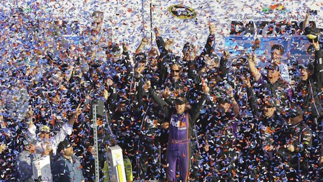 Denny Hamlin, center, celebrates in Victory Lane after winning the NASCAR Daytona 500 Sprint Cup Series auto race at Daytona International Speedway in Daytona Beach, Fla., Sunday, Feb. 21, 2016. AP