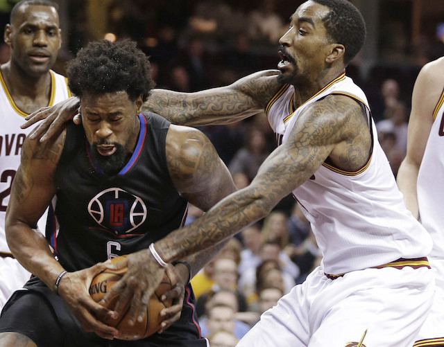 Los Angeles Clippers center DeAndre Jordan is fouled by Cleveland Cavaliers shooting guard JR Smith. AP