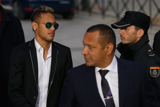 FC Barcelona's Neymar arrives with his father Neymar Santos, center, to the national court to testify in an investigation into alleged irregularities regarding his transfer to Barcelona, in Madrid, Tuesday, Feb. 2, 2016. The court is looking into a complaint made by a Brazilian investment group which claims it was financially harmed when Barcelona and Neymar allegedly withheld the real amount of the player's transfer fee from Brazilian club Santos in 2013. AP Photo