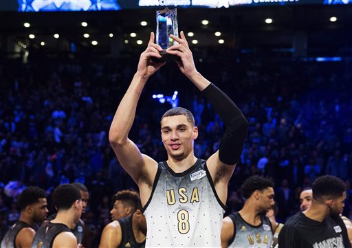 United States player Zach LaVine holds the MVP trophy after the NBA Rising Stars Challenge basketball game in Toronto, Friday, Feb. 12, 2016. (Mark Blinch/The Canadian Press via AP) 