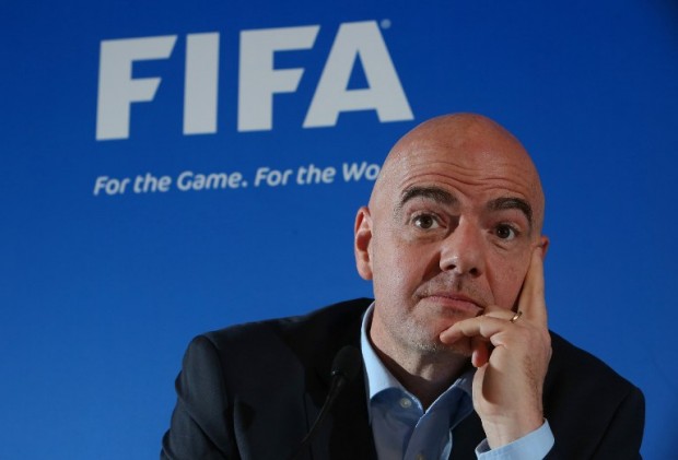 FIIFA president Gianni Infantino addresses a press conference at the St David's Hotel in Cardiff, Wales, on March 4, 2016.  The introduction of video technology, backed by new FIFA president Gianni Infantino, is set to move a step closer when the International Football Association Board meets in Cardiff on Saturday. / AFP / GEOFF CADDICK