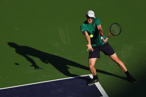 Jamie Murray of Great Britain with (out of frame) Bruno Soares of Brazil in action against Feliciano Lopez and Marc Lopez of Spain in the doubles during day eleven of the BNP Paribas Open at Indian Wells Tennis Garden on March 17, 2016 in Indian Wells, California.   Julian Finney/Getty Images/AFP