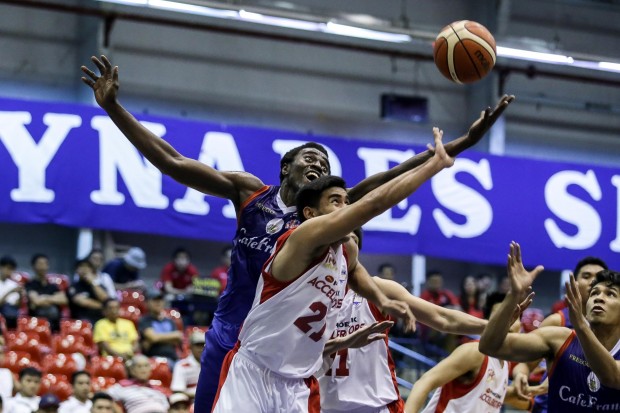 Rodrigue Ebondo goes for the rebound. Photo by Tristan Tamayo/INQUIRER.net