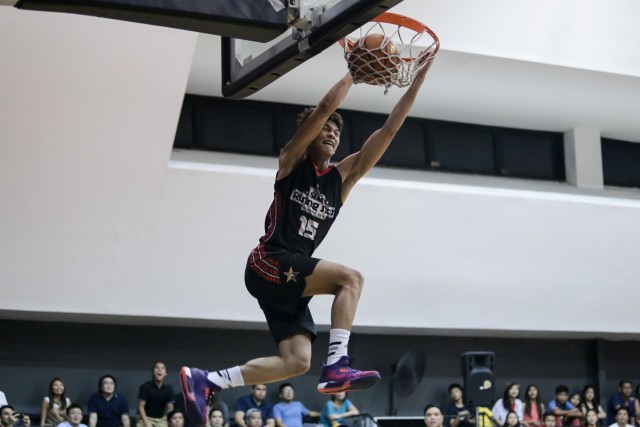 Ricci Rivero throws down the two-handed dunk.