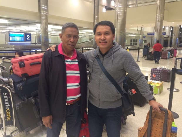 Manny Pacquiao's father Rosalio (left) and brother Rogelio arrive at LAX Wednesday night to lend moral support to Pacquiao. ROY LUARCA