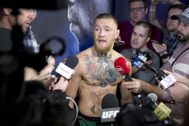 In this photo taken, Wednesday, March 2, 2016, UFC featherweight champion Conor McGregor talks with reporters during open workouts for UFC 196 at MGM Grand in Las Vegas. McGregor takes on Nate Diaz in UFC 196 on Saturday. (Steve Marcus/Las Vegas Sun via AP) LAS VEGAS REVIEW-JOURNAL OUT; MANDATORY CREDIT