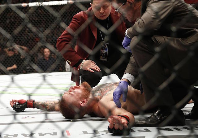 Conor McGregor recovers shortly after a second round-submission to Nate Diaz during their UFC 196 welterweight mixed martial arts match, Saturday, March 5, 2016, in Las Vegas. AP