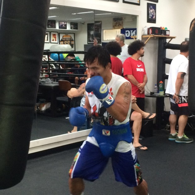 Manny Pacquiao pummels the heavy bag. Roy Luarca