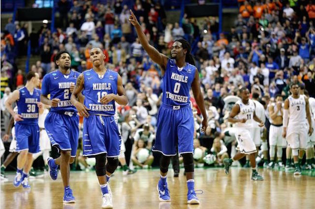 Middle Tennessee Darnell Harris (0), Jaqawn Raymond (10 ) and Perrin Buford (2) celebrate as they walk off the court after winning a first-round men's college basketball game against Michigan State in the NCAA Tournament, Friday, March 18, 2016, in St. Louis. Middle Tennessee won 90-81. AP