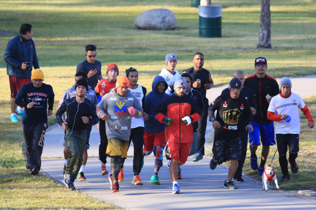 Manny Pacquiao runs with his team at the Pan Pacific Park in Hollywood a week before his scheduled fight against Timothy Bradley in Las Vegas. PHOTO BY REM ZAMORA/INQUIRER