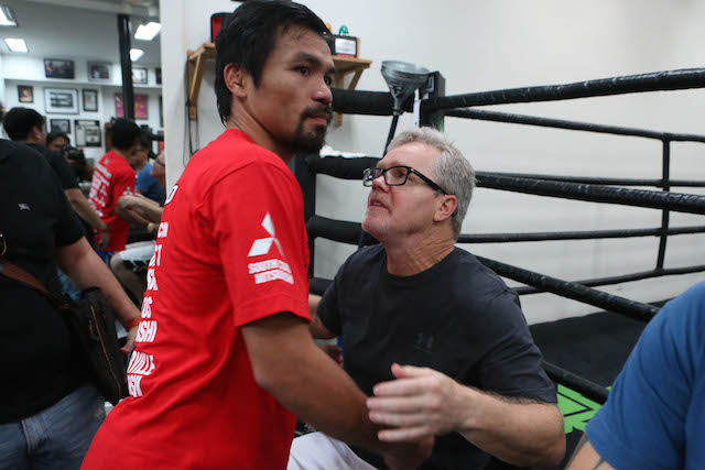 Manny Pacquiao gives trainer Freddie Roach a hug after his training inside the Wild Card gym in Los Angeles, California, April 4, 2016. "He's the best thing that ever happened to Wild Card; he's the best thing that happened in my life," said trainer Freddie Roach to Manny Pacquiao.    PHOTO BY REM ZAMORA