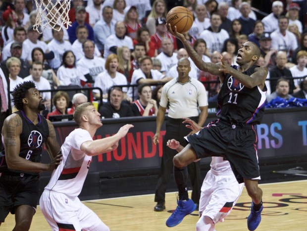 Los Angeles Clippers guard Jamal Crawford, right, shoots over Portland Trail Blazers center Mason Plumlee, second from left, during the second half of Game 6 of an NBA basketball first-round playoff series Friday, April 29, 2016, in Portland, Ore. The Trail Blazers won 106-103. (AP Photo/Craig Mitchelldyer)