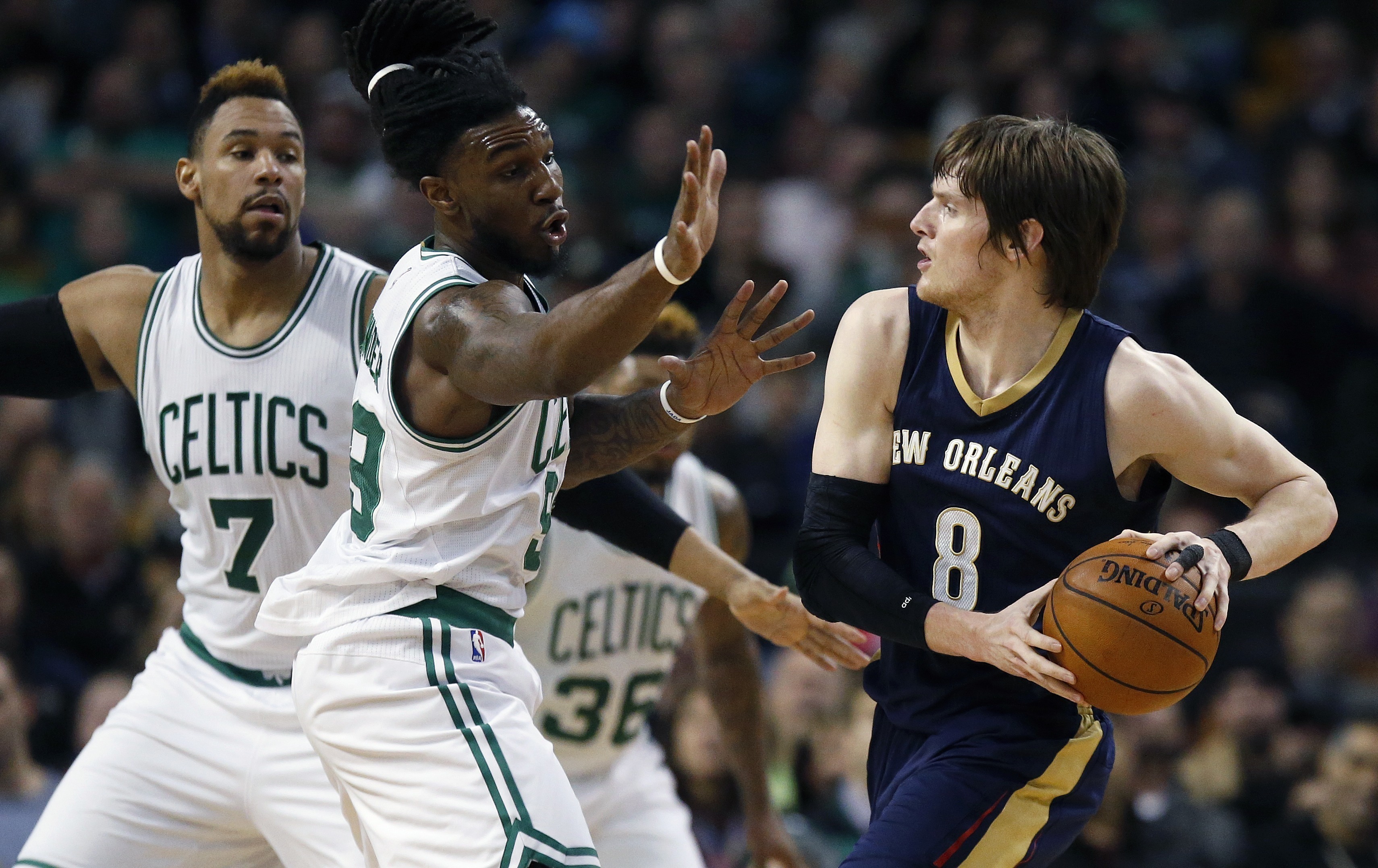 Boston Celtics' Jared Sullinger (7) and Jae Crowder, center, defend against New Orleans Pelicans' Luke Babbitt (8) during the second quarter of an NBA basketball game in Boston, Wednesday, April 6, 2016. AP