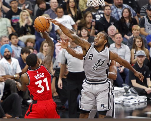 San Antonio Spurs' Kawhi Leonard (2) blocks the shot of Toronto Raptors' Terrence Ross (31). AP 