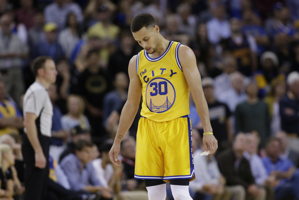 Golden State Warriors' Stephen Curry (30) looks down in the closing minutes of a 124-117 overtime loss to the Minnesota Timberwolves during an NBA basketball game Tuesday, April 5, 2016, in Oakland, California. AP