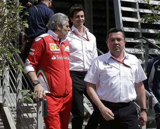 From left, Ferrari team principal Maurizio Arrivabene, Mercedes motorsport head Toto Wolff, center, and McLaren racing director Eric Boulilier leave the press center after a meeting prior to the start of the Bahrain Formula One Grand Prix, at the Formula One Bahrain International Circuit, in Sakhir, Bahrain. AP 