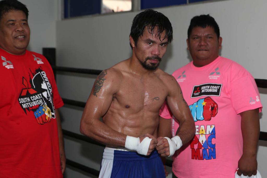 Manny Pacquiao shows off his abdominal muscle after training inside the Wild Card Gym in Los Angeles, California on Saturday afternoon. Pacquiao and Bradley will be fighting for the third time on April 9 at the MGM Grand Garden Arena in Las Vegas.     PHOTO BY REM ZAMORA