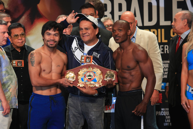Manny Pacquiao and Timothy Bradley Jr. during the official weigh in at the MGM Grand Garden Arena in Las Vegas. Pacquiao weighed in at 145.5lbs while Bradley tipped the scales at 146.5lbs. In the middle is four-time division world champion Roberto Duran. PHOTO BY REM ZAMORA